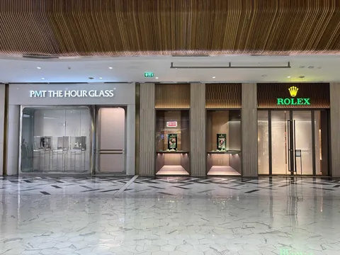 Illuminated PMT The Hour Glass and Rolex storefront