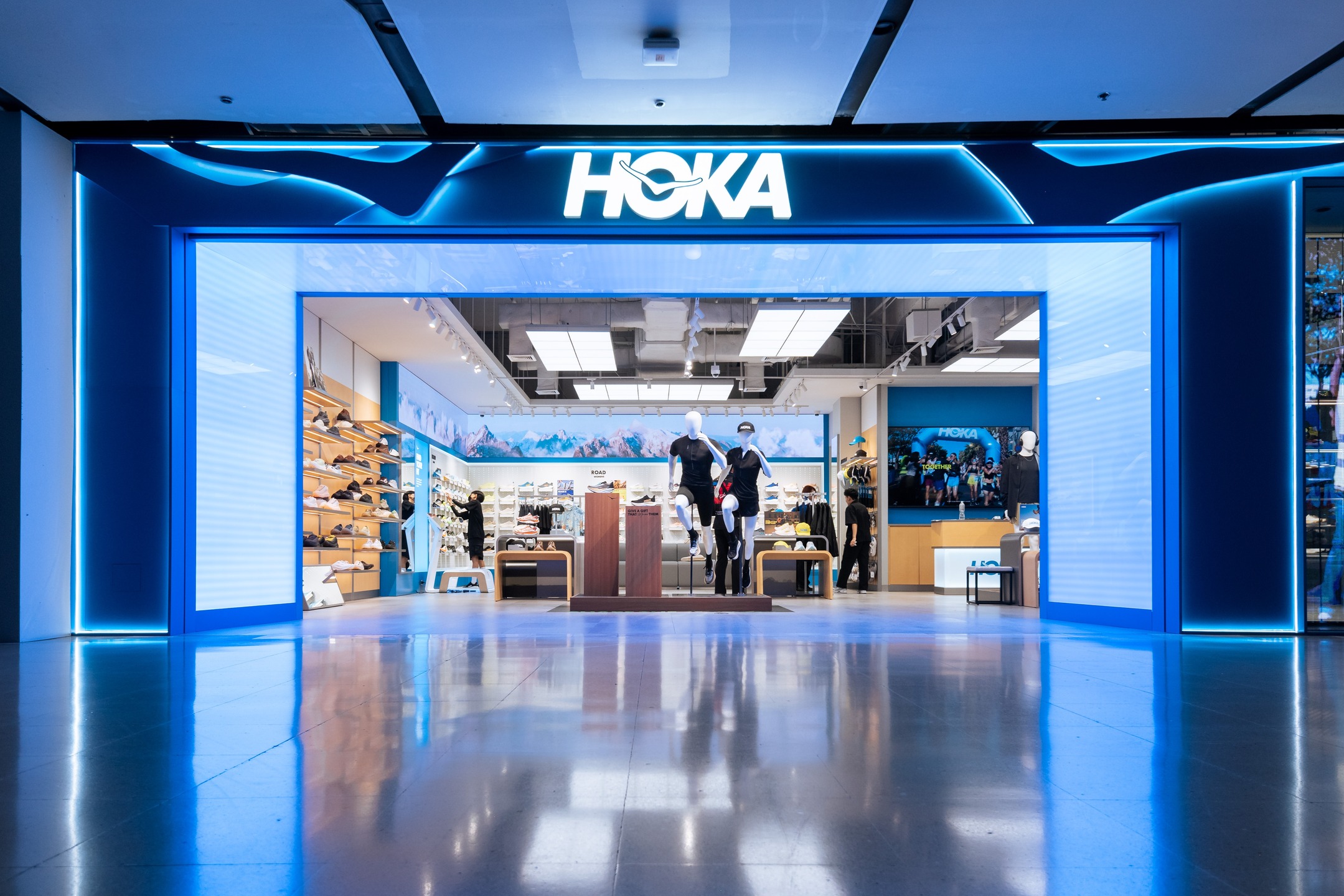Illuminated storefront facade with backlit logo signage