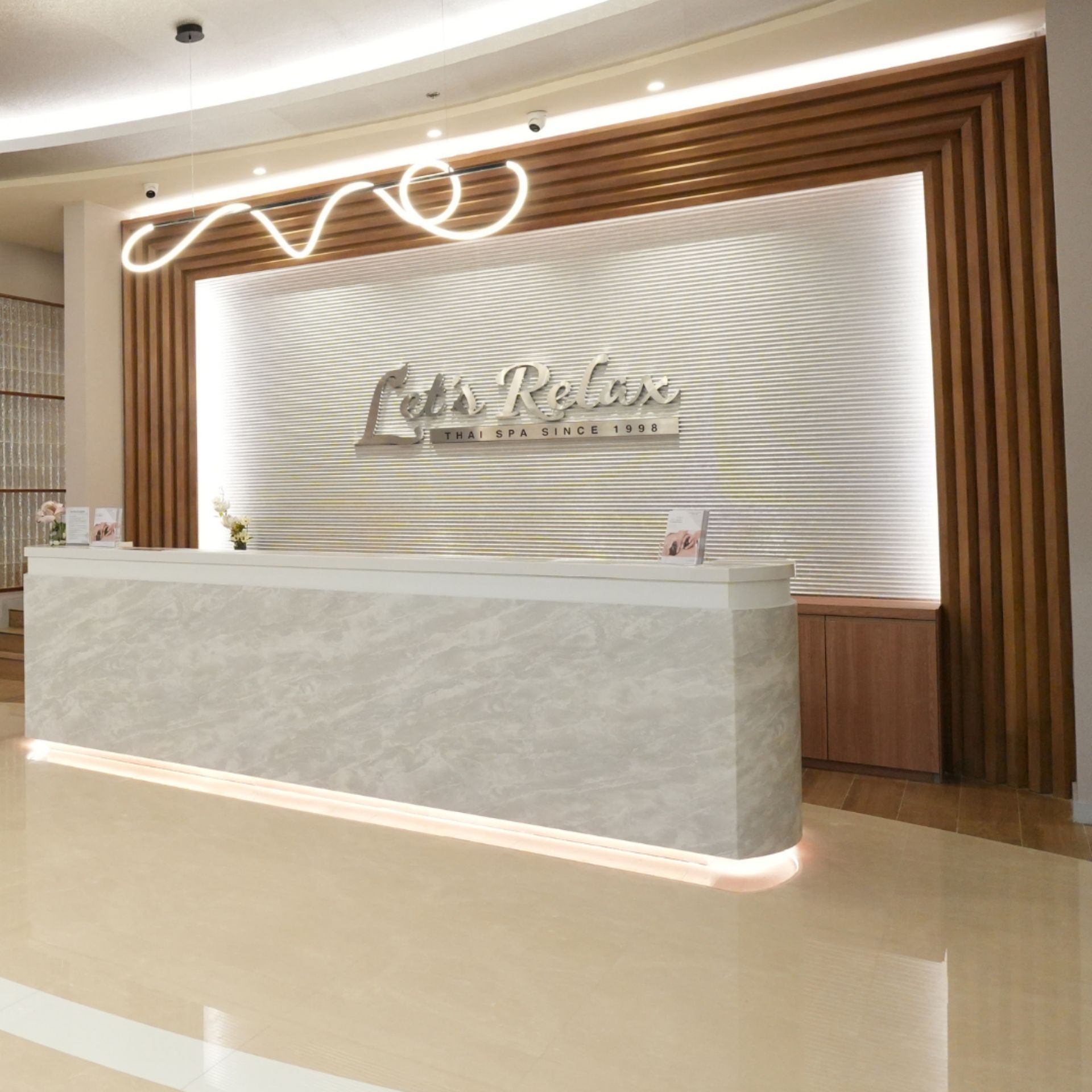 Warm cove and signage lighting at Let's Relax Dusit Central Park